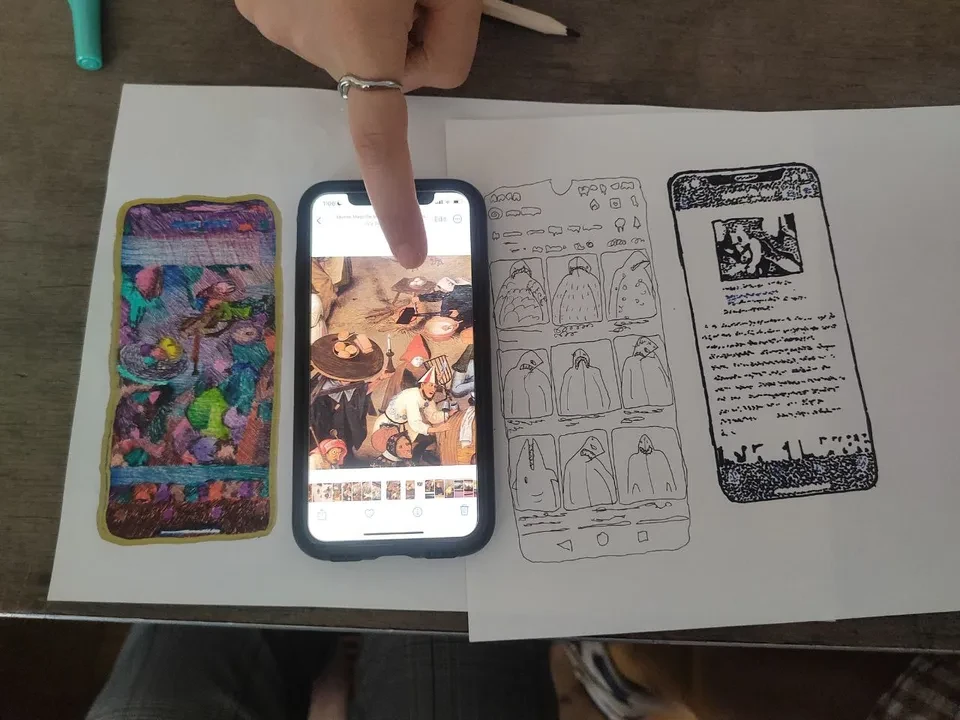 People hidden under a black cloth to trace their phone
